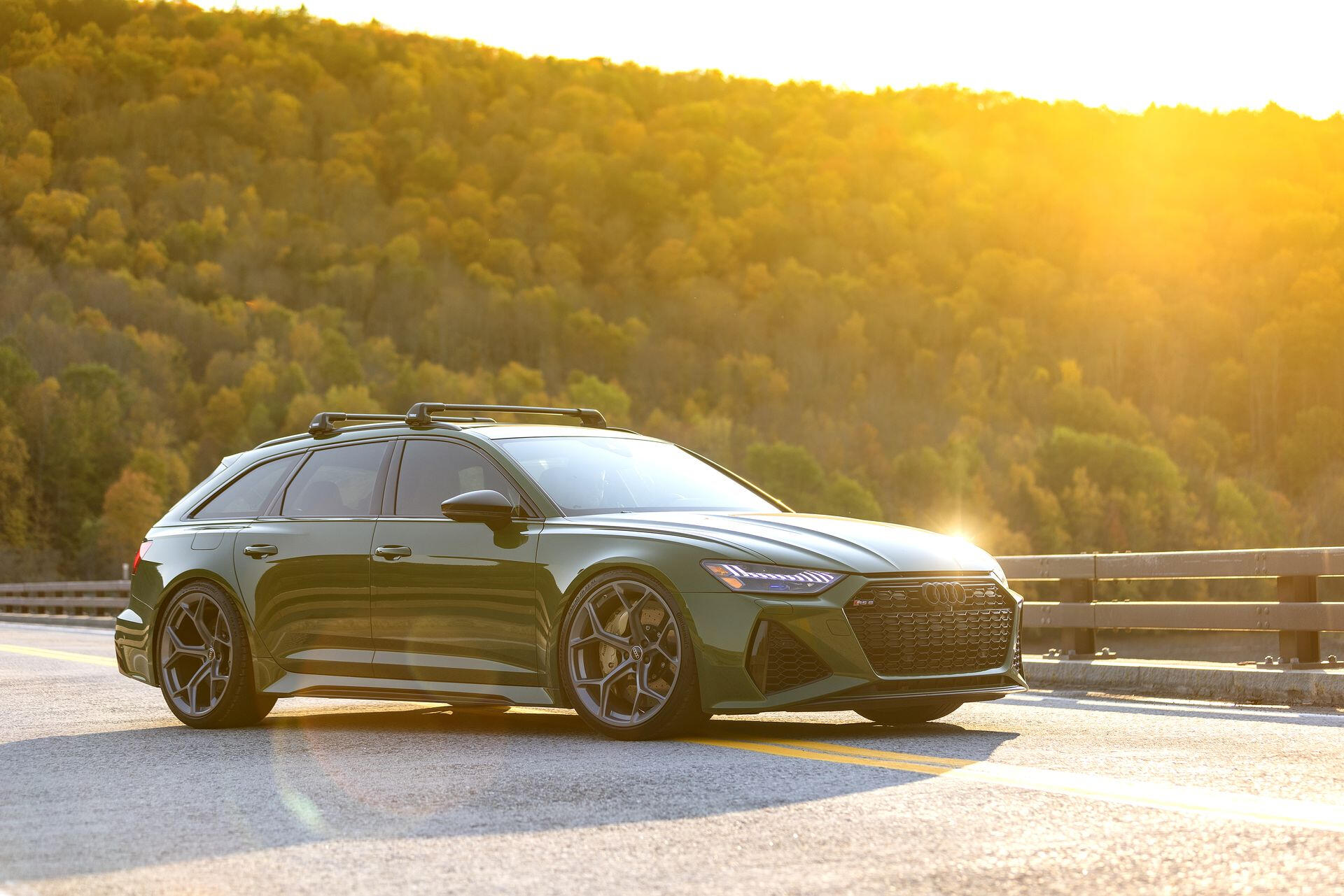 Brian Karschti's green Audi RS6 Avant on a bridge surrounded by fall colours